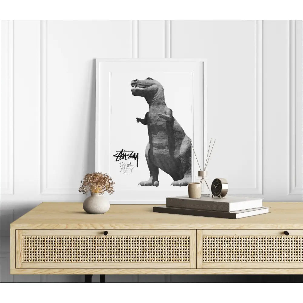 Framed artwork of a dinosaur on a wall above a wooden console table.
