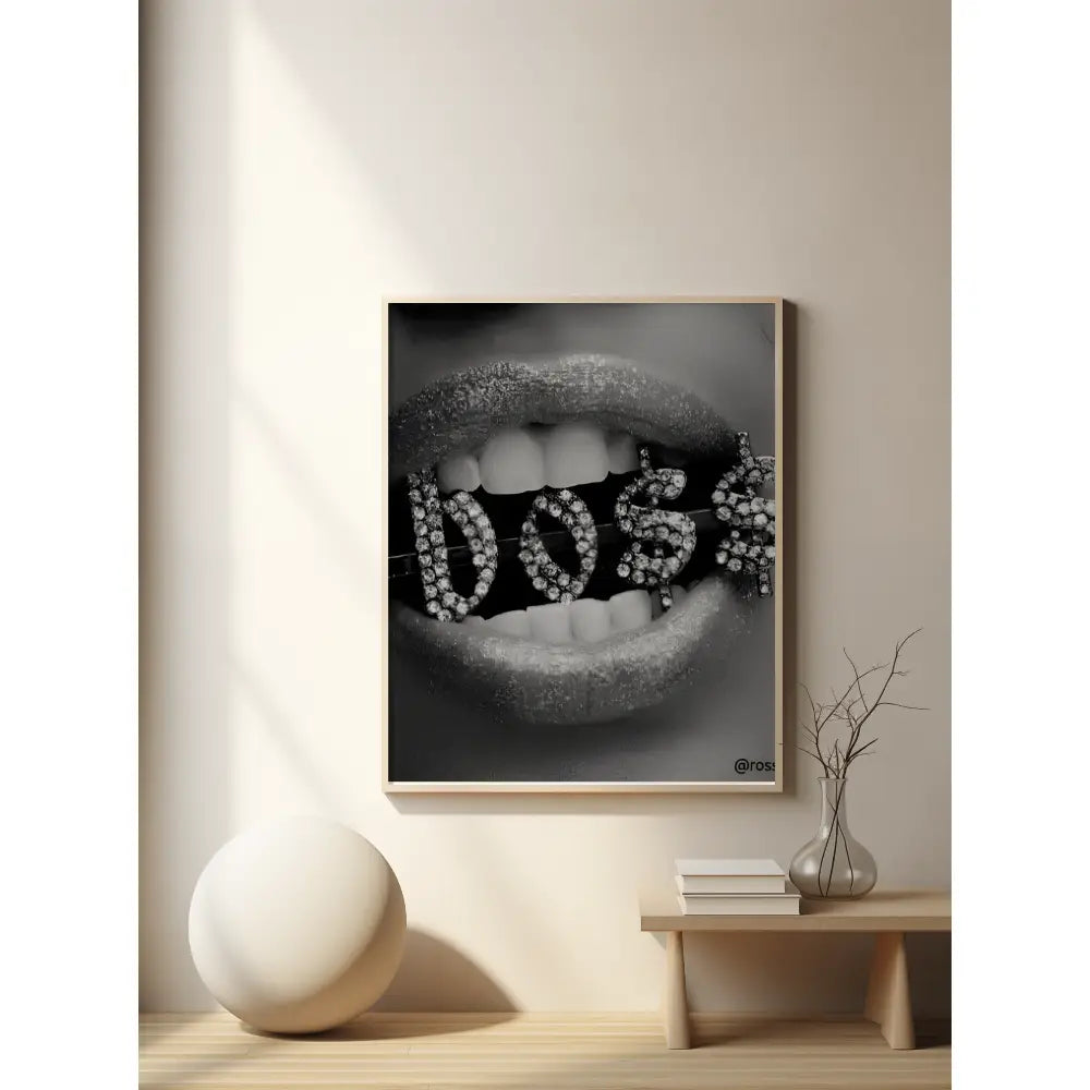 Framed artwork of lips with 'BOSS' text on a wall in a modern interior setting.
