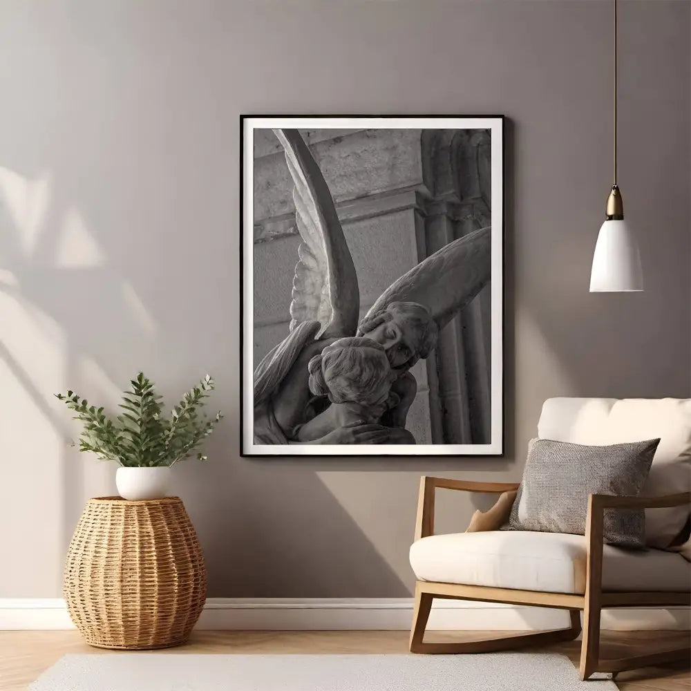Framed black and white artwork above a chair in a living room setting.