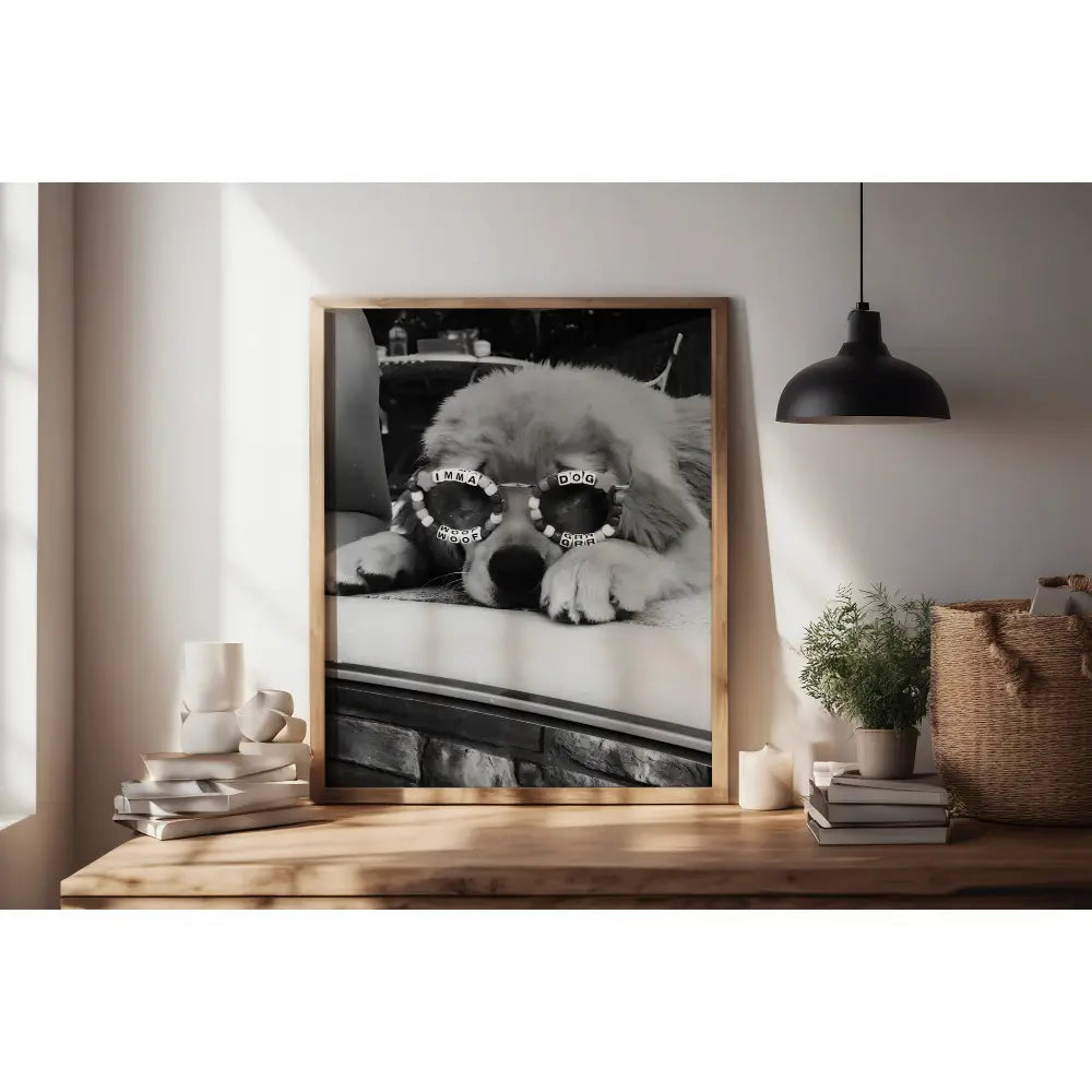 Framed picture of a dog wearing sunglasses on a wooden shelf with decor items.