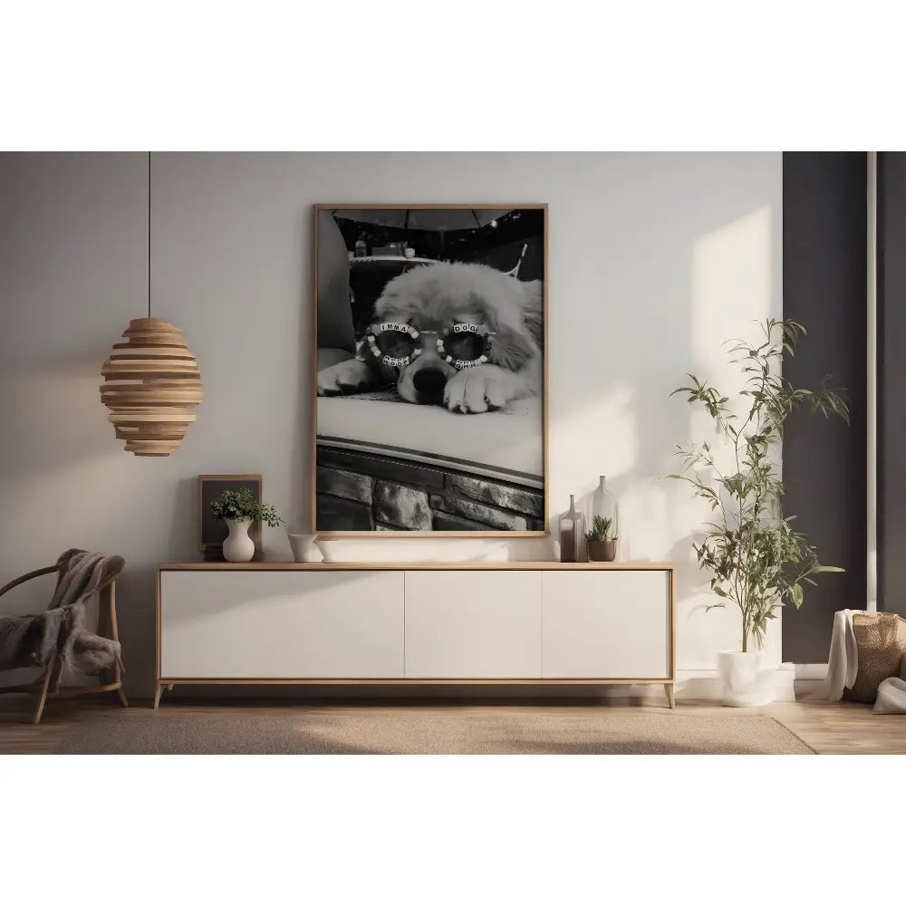 Modern living room with a white console table, framed black and white photo of a dog, and decorative plants.