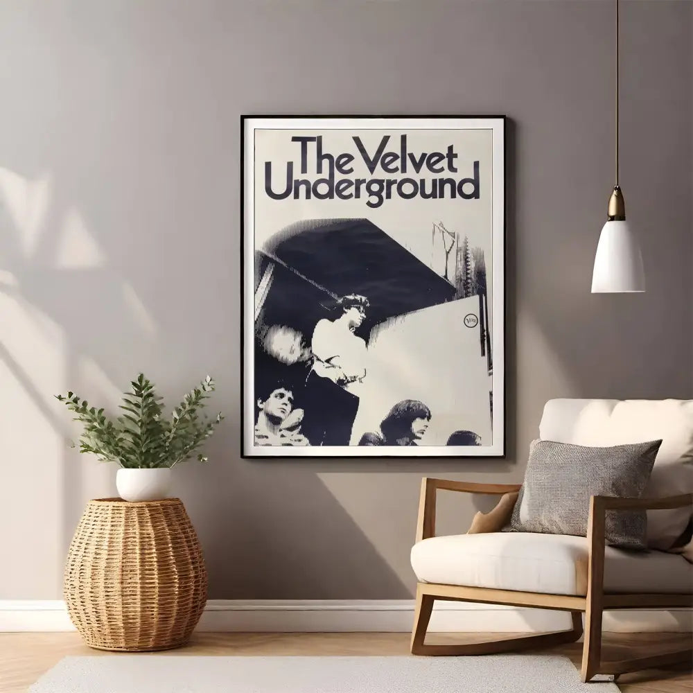 Framed 'The Velvet Underground' poster in a living room setting with a chair and plant.