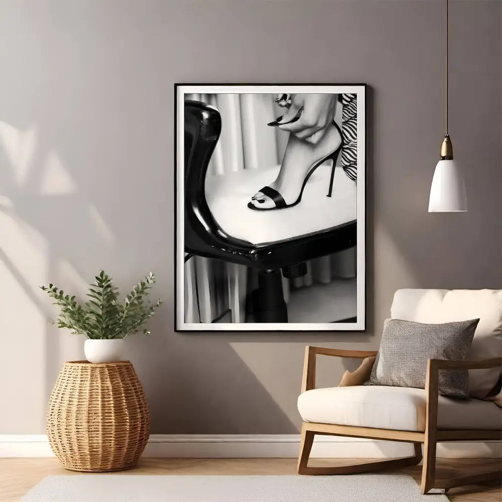 Framed black and white art print of a high heel shoe in a living room setting.