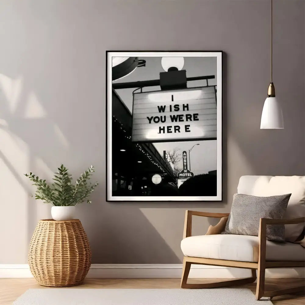 Framed artwork with 'I Wish You Were Here' quote in a living room setting.